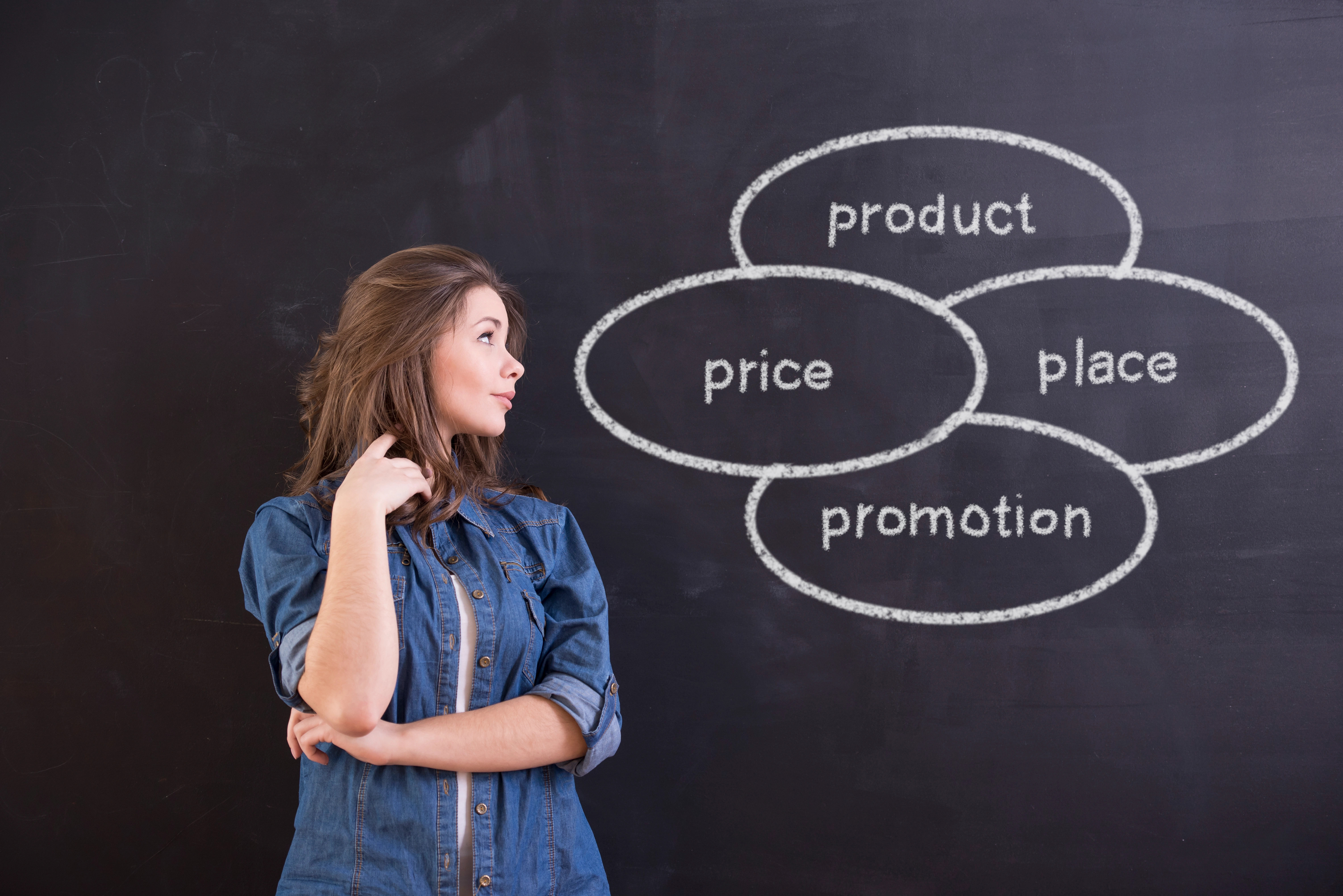 woman is standing front blackboards